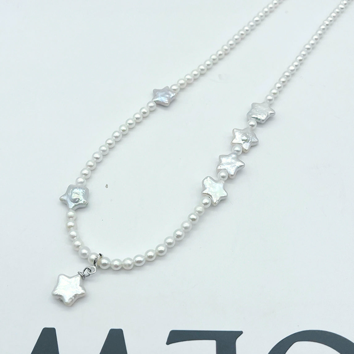 Collier étoile blanche et perles akoya