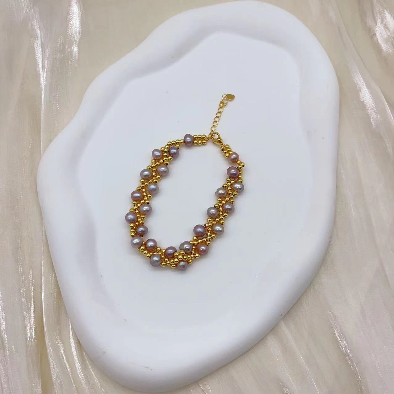 (B043) Freshwater pearl strand interwoven with thread bracelet