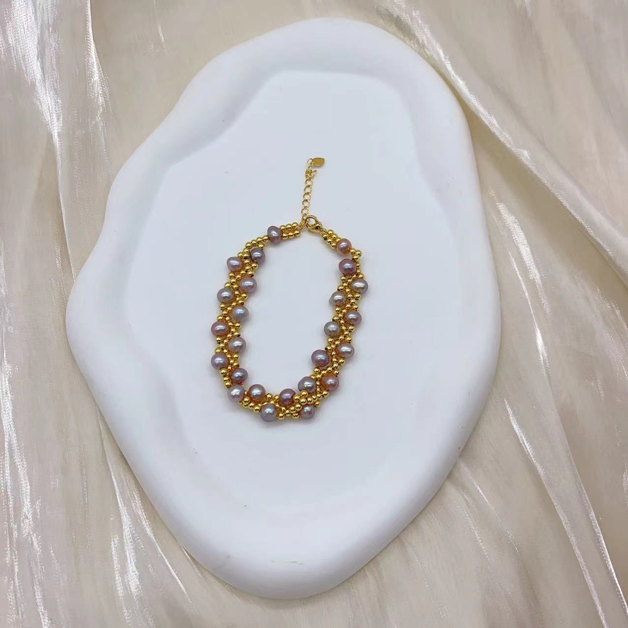 (B043) Freshwater pearl strand interwoven with thread bracelet