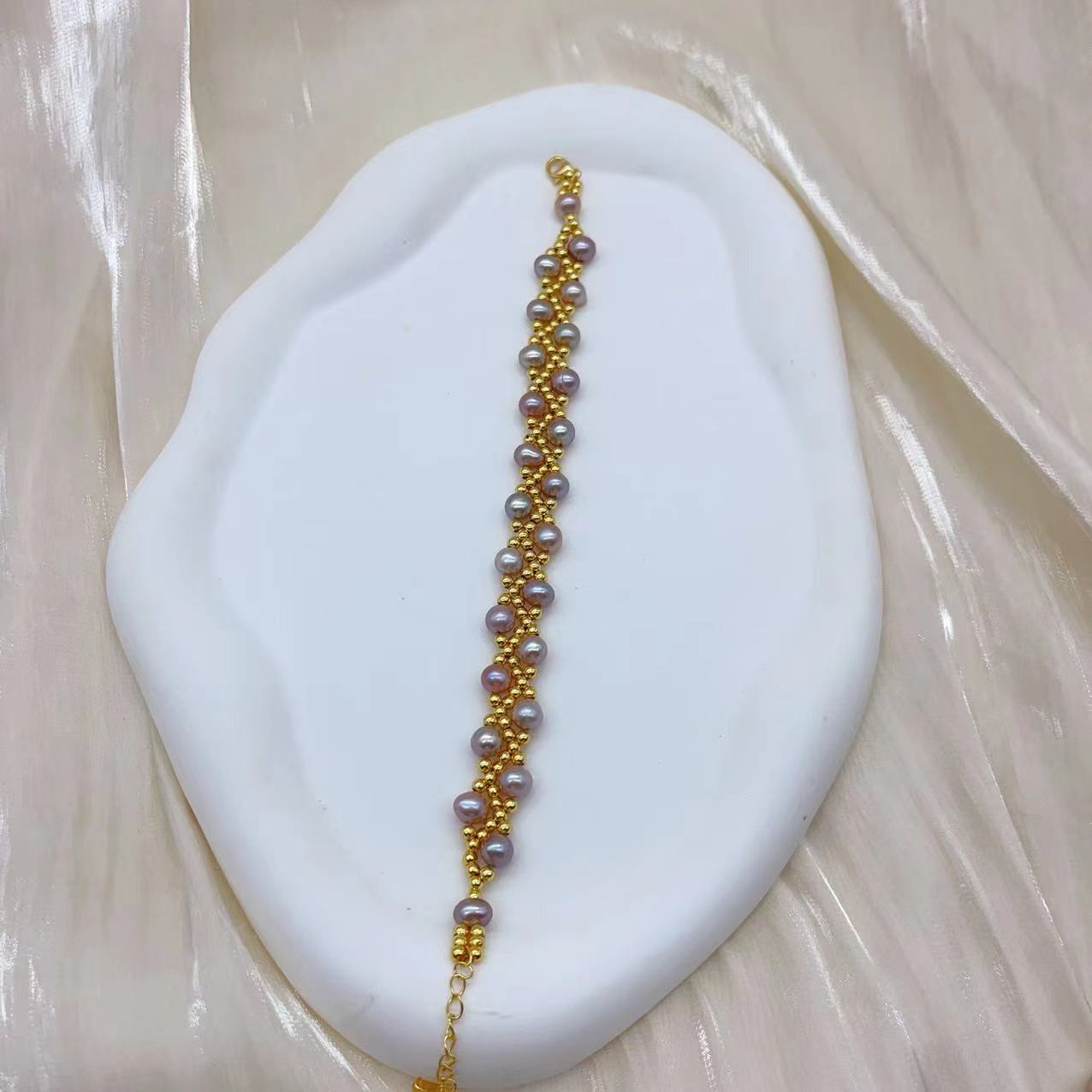 (B043) Freshwater pearl strand interwoven with thread bracelet