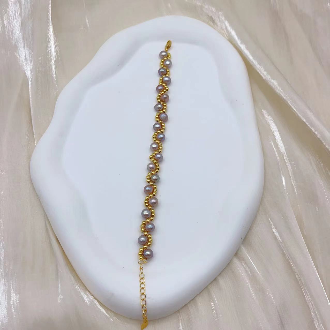 (B043) Freshwater pearl strand interwoven with thread bracelet