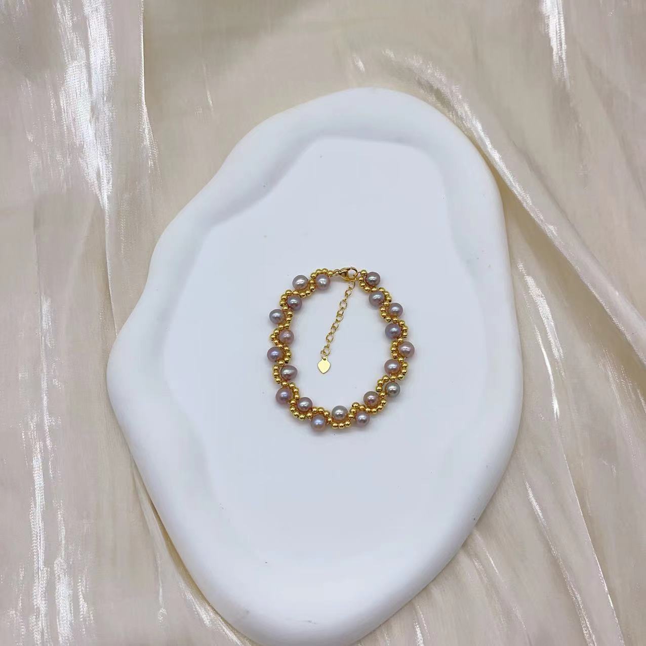 (B043) Freshwater pearl strand interwoven with thread bracelet