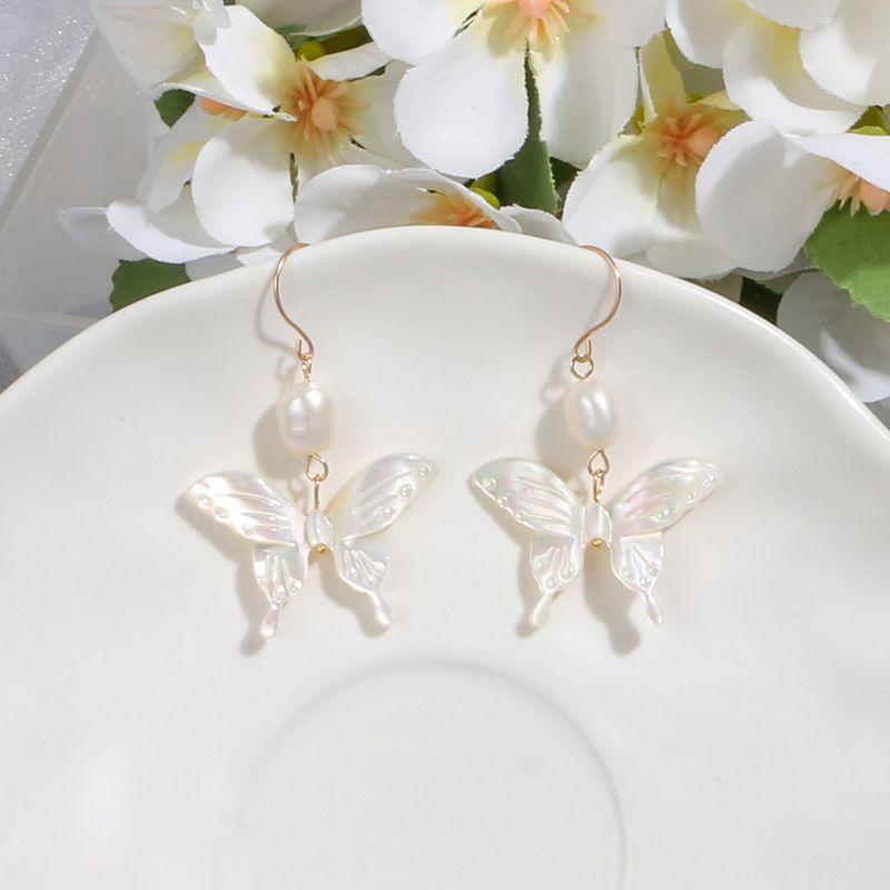 (E046) Butterfly shell pearl hoop earrings