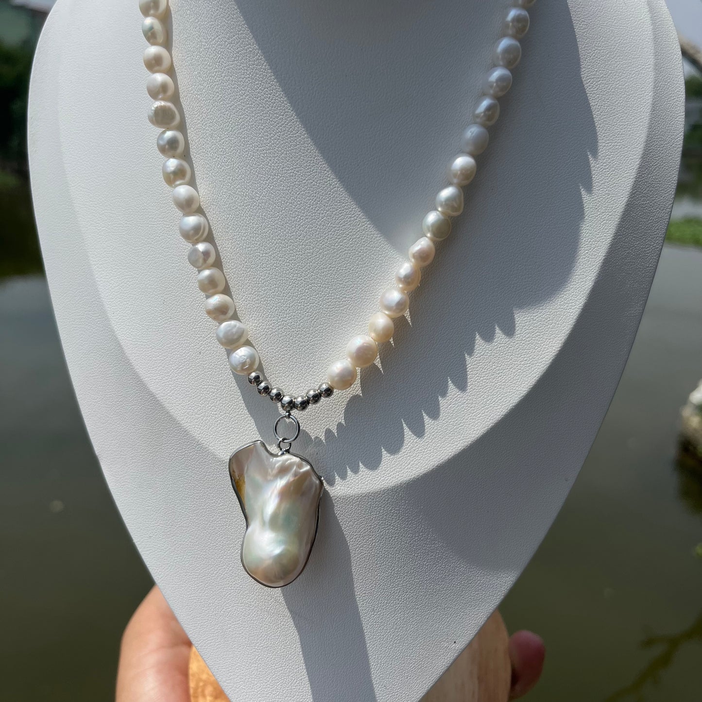 Necklace with a legendary & other pearls